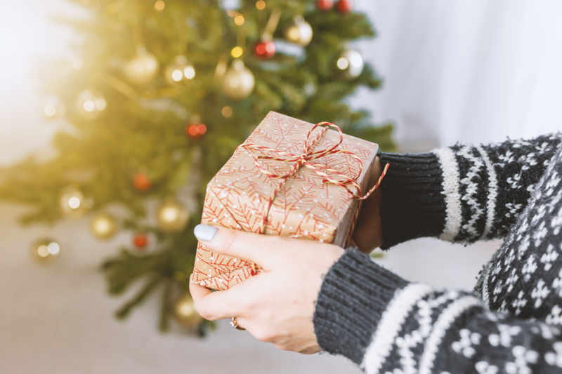 Woman holding Christmas gift